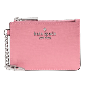A pink Kate Spade New York coin pouch with a silver zipper and keychain. The brand logo is embossed on the front.