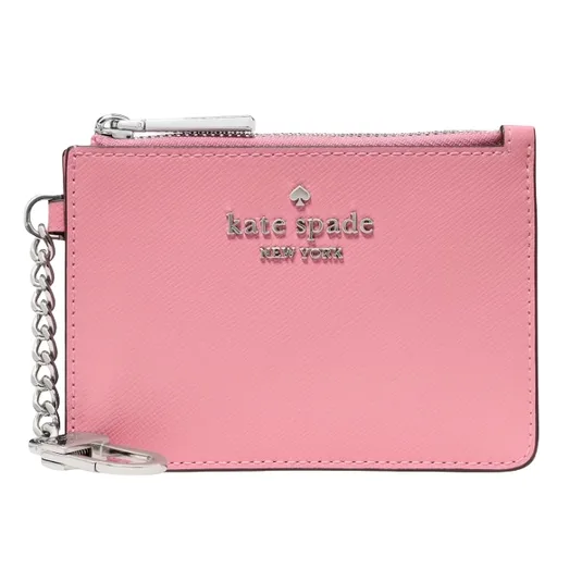 A pink Kate Spade New York coin pouch with a silver zipper and keychain. The brand logo is embossed on the front.