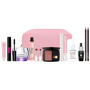 A collection of Lancôme beauty products displayed with a pink makeup bag, including mascara, Rénergie cream, Idôle fragrance, blush, UV Expert sunscreen, Génifique serum, lipsticks, eyeliner pencils, and a gloss.