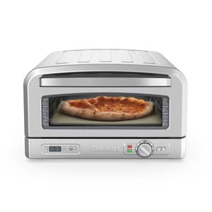 A compact Cuisinart toaster oven with a pizza being cooked inside, featuring digital controls and a viewing window.