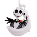 A Halloween-themed ornament featuring a skeleton with a stitched smile, wearing a black suit, and a ghost-like figure with a pumpkin nose, likely from a popular animated film.
