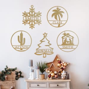Circular wall signs, each featuring a different holiday-themed design—snowflake, palm tree, cactus, Christmas tree, nativity scene—and personalized with a family name.