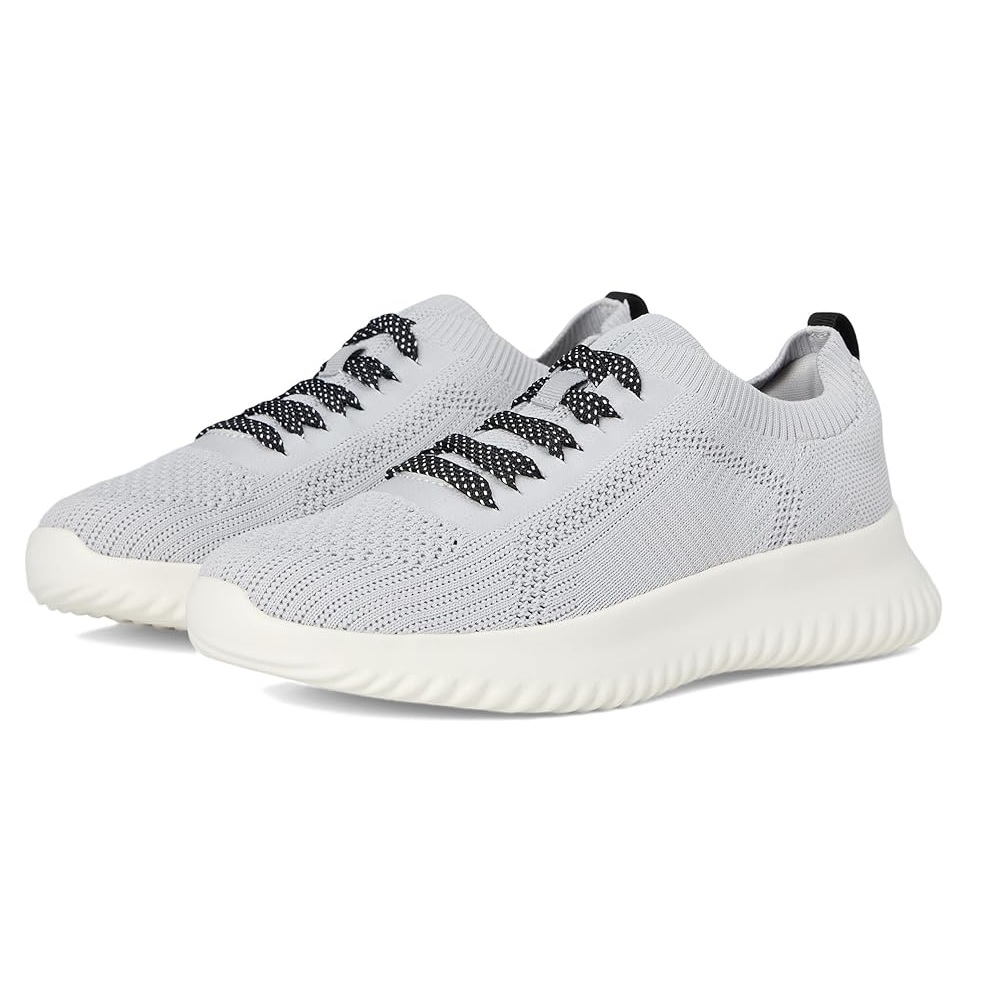 A pair of light gray athletic sneakers featuring a knitted texture, ribbed sole, and black-accented laces.