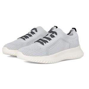 A pair of light gray athletic sneakers featuring a knitted texture, ribbed sole, and black-accented laces.