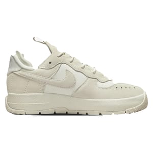 A beige Nike sneaker with a distinctive swoosh logo and textured sole.