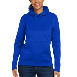 A woman wearing a royal blue hoodie featuring a front pocket and drawstring hood, paired with dark jeans.