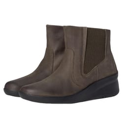 Brown ankle-length Clarks leather boots feature elastic side panels for easy wear and a slight wedge heel, suitable for both casual and semi-formal settings.