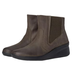 Brown ankle-length Clarks leather boots feature elastic side panels for easy wear and a slight wedge heel, suitable for both casual and semi-formal settings.