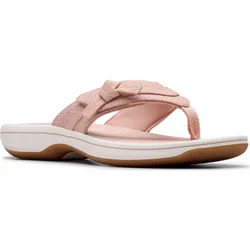 A pink flip-flop sandal featuring a cushioned sole and textile straps with a decorative bow, set on a rubber outsole with a white midsole.