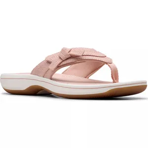A pink flip-flop sandal featuring a cushioned sole and textile straps with a decorative bow, set on a rubber outsole with a white midsole.