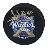 Signed hockey puck with the New York Rangers logo, commemorating the 10th Anniversary Winter Classic at Citi Field, 2018, featuring a gold signature on the front.