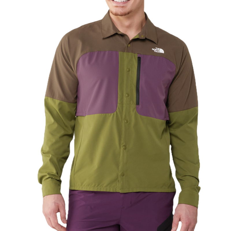 The North Face UPF Long-Sleeve Shirt features a color-block design with green, brown, and purple panels, button closure, and a chest pocket with a zipper. It's designed for outdoor use with UPF protection.