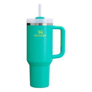 A teal Stanley tumbler with a handle and straw, featuring a stainless steel rim near the top.