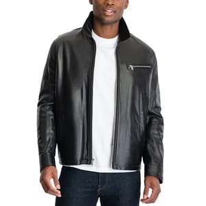 A man is wearing a black leather jacket with a front zipper and a zippered chest pocket, paired with a white T-shirt and dark jeans.