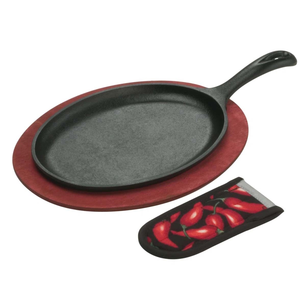 Cast iron sizzle platter with a red wooden trivet and a handle cover featuring red chili pepper designs.