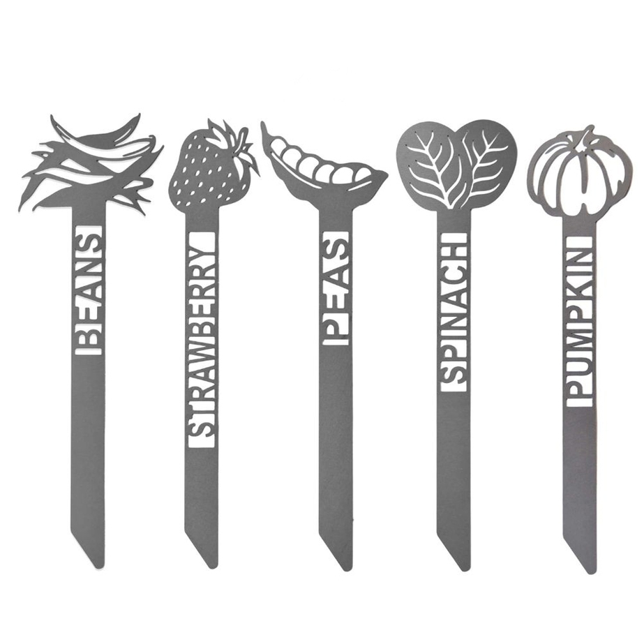 Garden plant markers for beans, strawberry, peas, spinach, and pumpkin, each featuring a cutout design of the respective plant above the name.