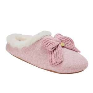 A pink slipper featuring a cozy white fur lining and a decorative knitted bow on top with a small gold emblem.