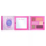Too Faced \“Life's a Fairytale\“ eyeshadow palette featuring six shades in a pink case with an integrated mirror.