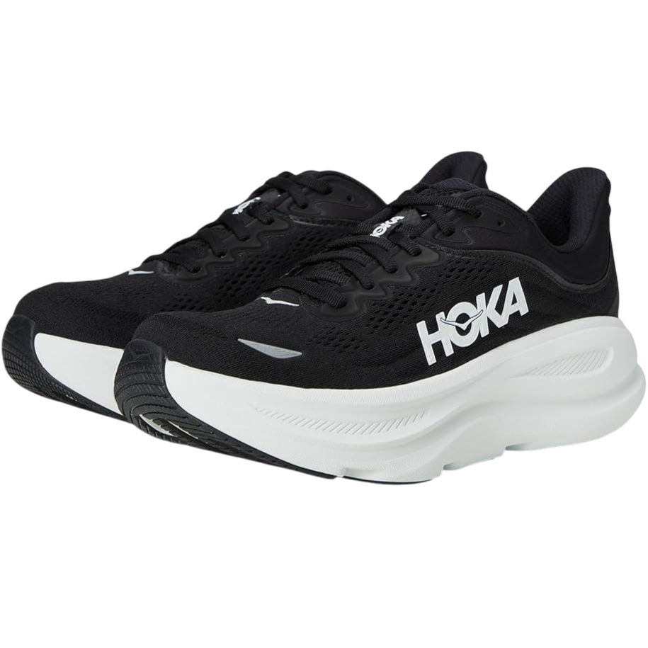 Black and white Hoka running shoes featuring a thick cushioned sole, mesh upper for breathability, and a logo on the side.
