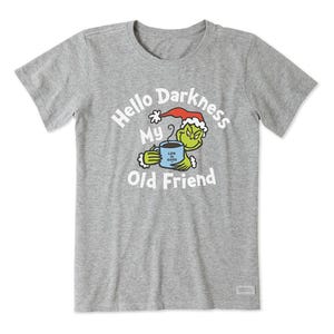 A gray t-shirt with a graphic of the Grinch holding a coffee cup, and the words \“Hello Darkness My Old Friend\“ above.