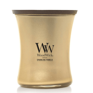 WoodWick candle in Sparkling Pomelo scent with a gold-colored glass container and wooden lid.