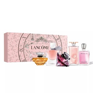 Lancôme fragrance gift set featuring four different perfumes, each in a distinct bottle. The set is presented in a pink box decorated with a vintage-style Parisian design.
