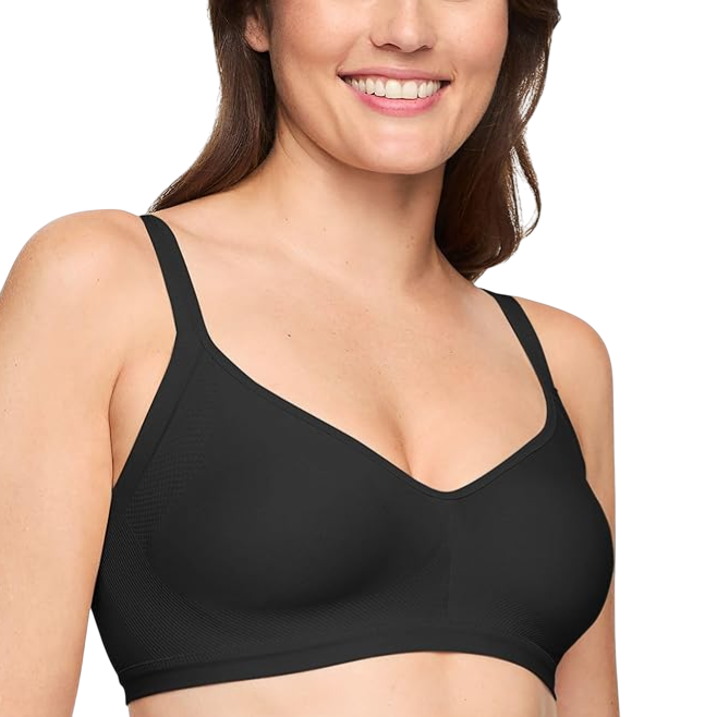 A woman is wearing a black, seamless, wire-free bra with adjustable straps. She is smiling and the focus is on the fit and design of the bra.