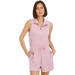 A woman is wearing a sleeveless, light pink romper with a zipper front and drawstring waist, featuring side pockets.
