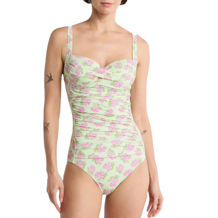 One-piece swimsuit with a light green base, featuring a pink floral pattern and adjustable shoulder straps.