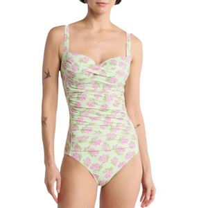 One-piece swimsuit with a light green base, featuring a pink floral pattern and adjustable shoulder straps.