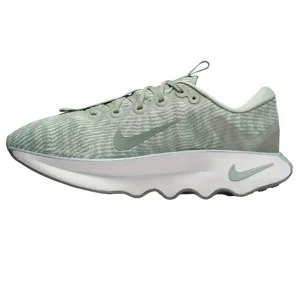 Light green Nike walking shoes with a textured upper, featuring Swoosh logos and a wavy sole design.