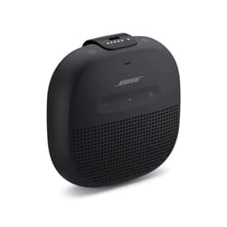 A compact Bose SoundLink Micro Speaker in black with a durable strap, featuring control buttons on top and a grille design for the speaker element.