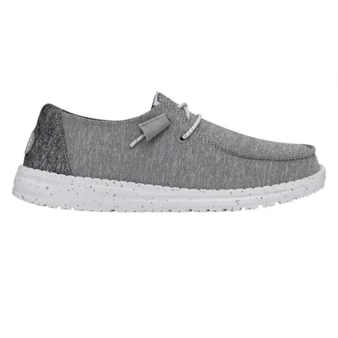 Gray slip-on shoes with a textured fabric upper, white speckled sole, and elastic laces for easy wear.