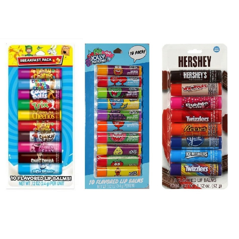 The image shows three packs of flavored lip balms: a breakfast cereal-themed pack, a Jolly Rancher pack, and a Hershey's pack with various flavors, including Whoppers, Bubble Yum, Twizzlers, and Reese's, among others. Each pack contains around 8-10 lip balms.