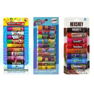 The image shows three packs of flavored lip balms: a breakfast cereal-themed pack, a Jolly Rancher pack, and a Hershey's pack with various flavors, including Whoppers, Bubble Yum, Twizzlers, and Reese's, among others. Each pack contains around 8-10 lip balms.