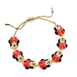 A bracelet featuring multiple gold-colored charms shaped like a well-known animated character with red bows and black accents, attached to an adjustable gold-tone chain.