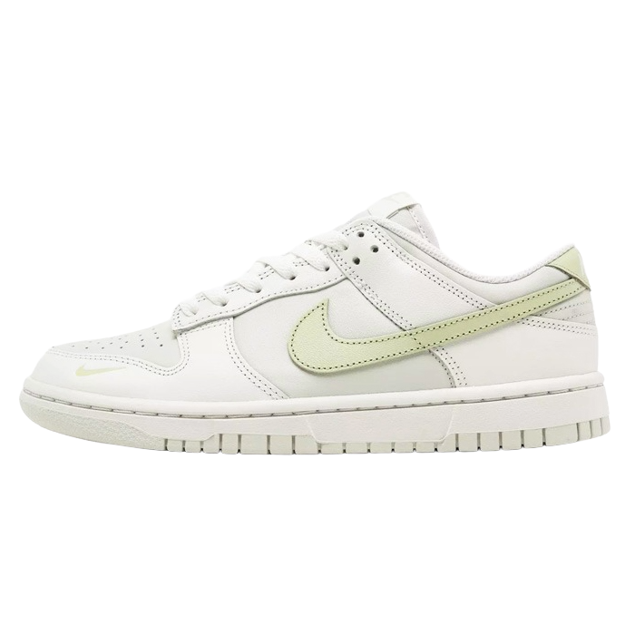A white Nike Dunk Low sneaker with light green accents and a matching sole.