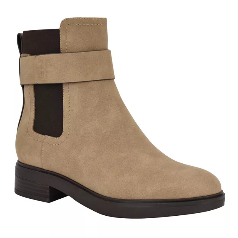 Tommy Hilfiger Chelsea Boots in beige feature a strap detail, elastic side panels for easy wear, and a low stacked heel. The design is sleek and versatile for casual or semi-formal outfits.