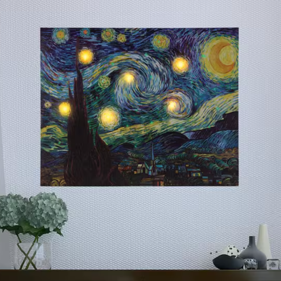 A wall art print of Van Gogh's Starry Night over a vase with hydrangeas and decorative bottles.