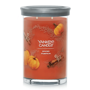 Yankee Candle with Spiced Pumpkin scent, orange wax in a glass jar with a metal lid.