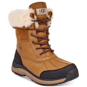 UGG waterproof boots with a tan leather upper, lace-up front, black rubber toe cap, and shearling lining, providing warmth and protection.