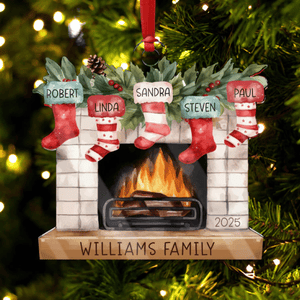 A personalized Christmas ornament features a fireplace with stockings named Robert, Linda, Sandra, Steven, and Paul, marked with \“Williams Family\“ and the year 2025.