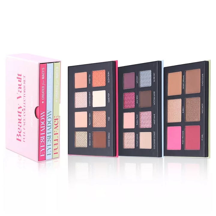 A makeup set featuring three palettes within a pink box labeled \“Beauty Vault Full Face Collector’s Set,\“ includes eyeshadow and full-face options with various shades.