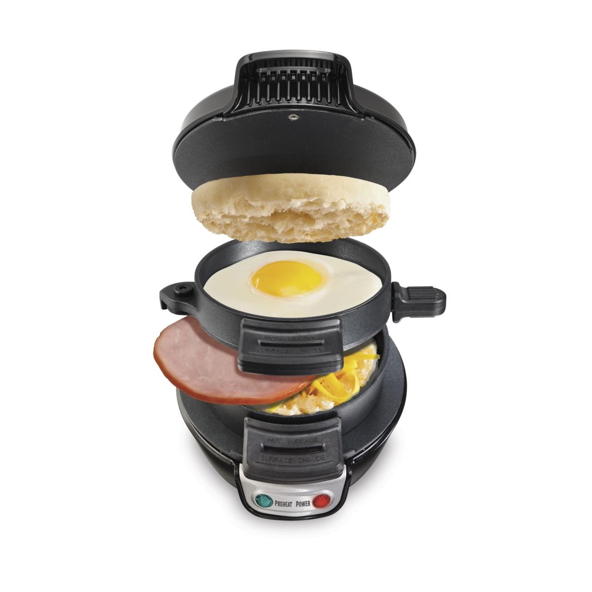 An electric breakfast sandwich maker with layers for bread, egg, meat, and cheese.