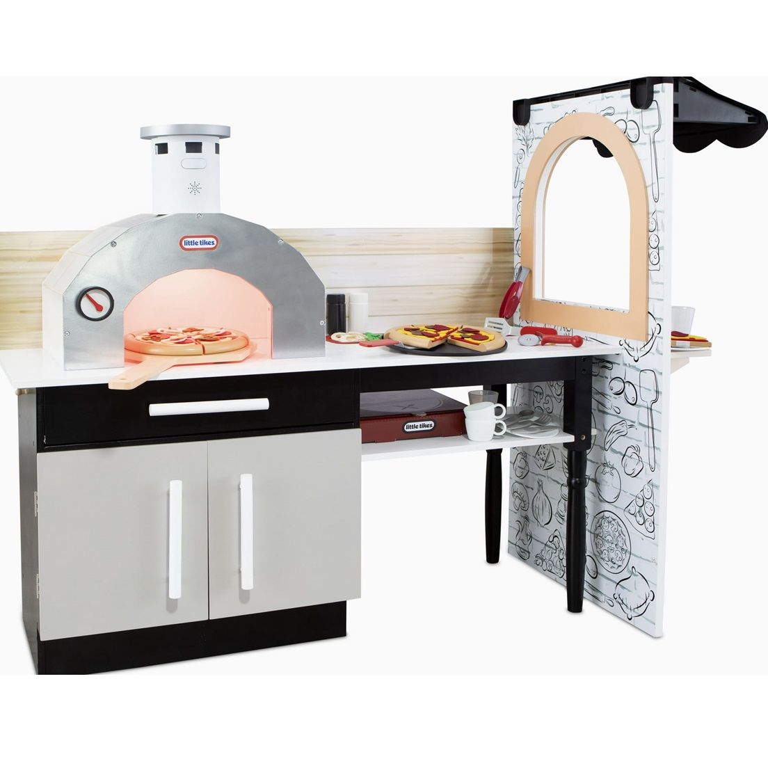 The Little Tikes Pizza Restaurant Playset features a pretend pizza oven with accessories like a pizza paddle, cups, and assorted play food toppings, allowing kids to simulate a pizza-making experience.