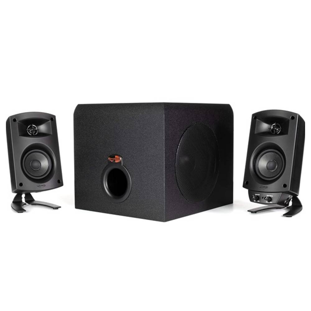 A Klipsch computer speaker system with a central subwoofer and two satellite speakers, designed for enhanced audio experience. The setup is compact and suitable for desktop use.