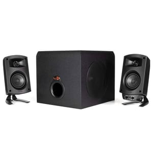 A Klipsch computer speaker system with a central subwoofer and two satellite speakers, designed for enhanced audio experience. The setup is compact and suitable for desktop use.