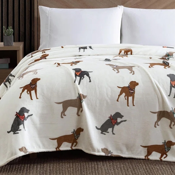 A plush queen blanket featuring a pattern of Labrador dogs wearing bandanas, set against a light background.