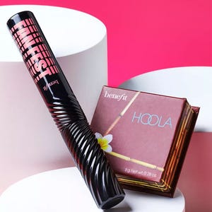 Mascara tube and a boxed bronzing powder.