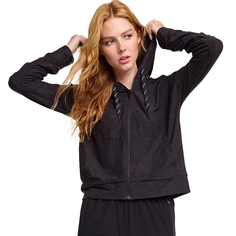 A black full-zip hoodie with a drawstring hood and long sleeves, modeled by a woman with long wavy hair.